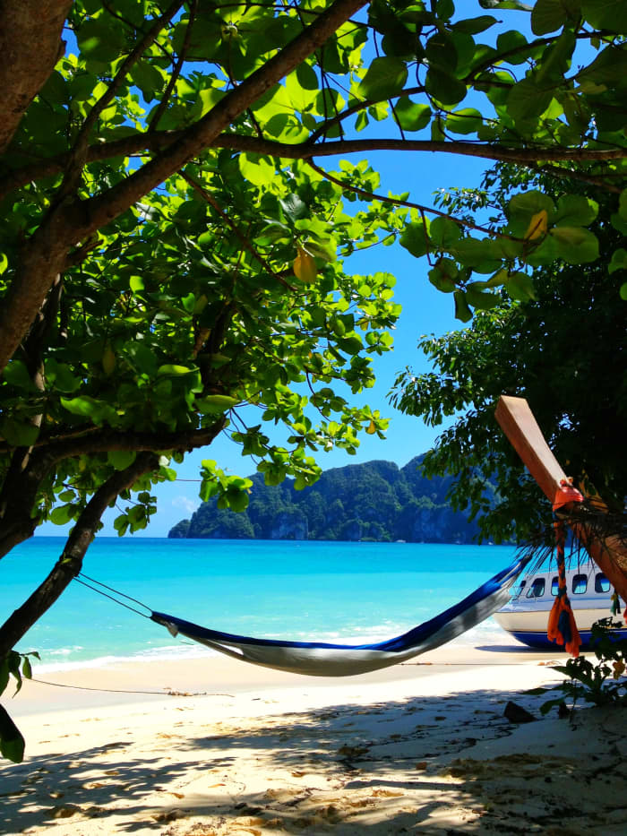 My Brazilian hammock, saving some shade under a few trees on Long Beach, Koh Phi Phi. Hammock fits in to a small, compact carrying case with easy assembly and tear down.