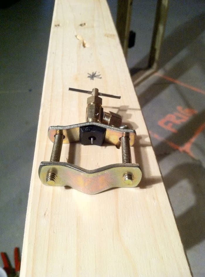 Notice how the needle is recessed into the rubber gasket and that the gasket is seated on the valve so that the curvature of the two match up.
