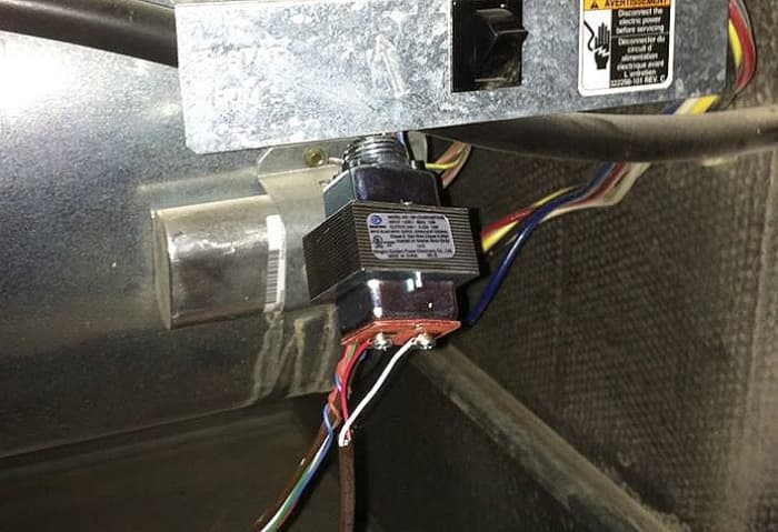 Connect your red and white low-voltage wires to the transformer. It doesn't matter which color goes to which side; just remember where they're going.