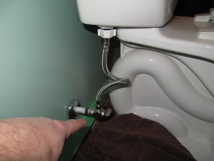 If you have a shut-off valve, turn the water off to your toilet right from there. If not, then you will have to turn the water meter off.