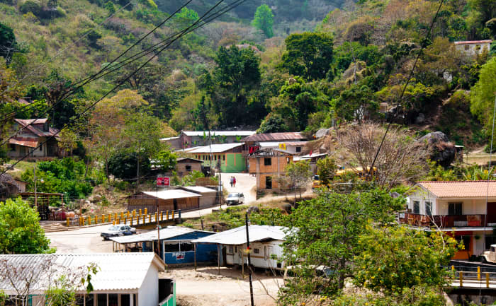 "Downtown" San Juancito. A couple little stores beside the yellow and blue bridge.
