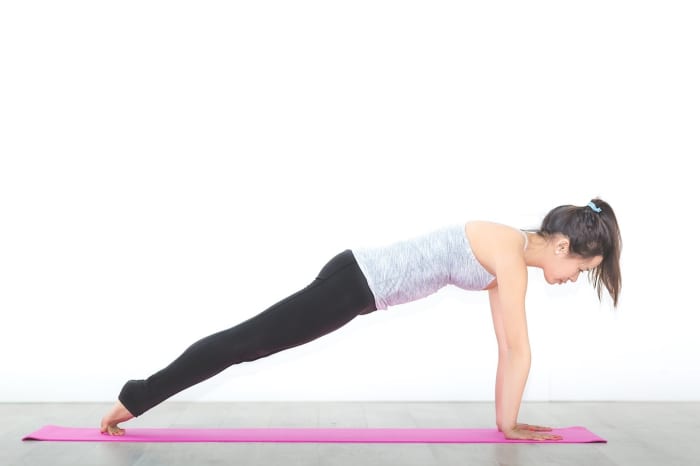 The plank pose strengthens your spine, your rhomboids and trapezius, and your abdominal muscles.