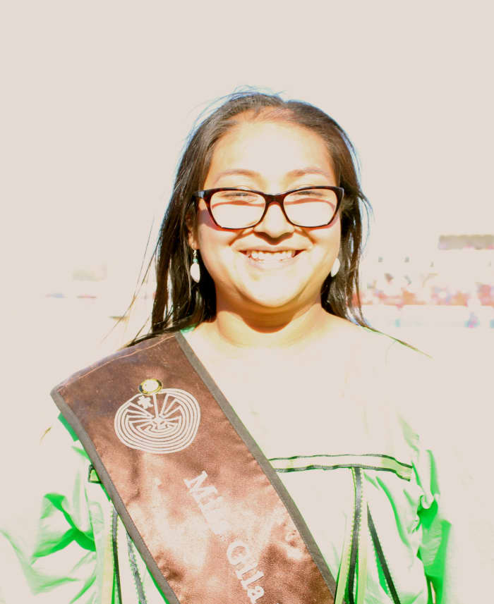 Tribal royalty, including this lovely attendant to Miss Gila River, offered a smile and handshake to visitors.