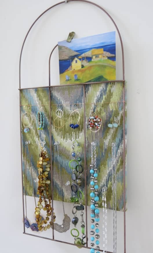 a simple garden fence can be turned into a charming and handy bulletin board or jewelry organizer
