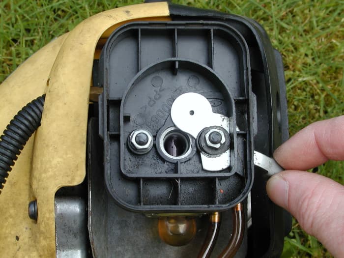 The choke is simply a plate which covers the air intake. When it is closed, the engine sucks in a richer mixture (i.e a higher concentration of fuel in the air/fuel mixture). This makes for easier starting.