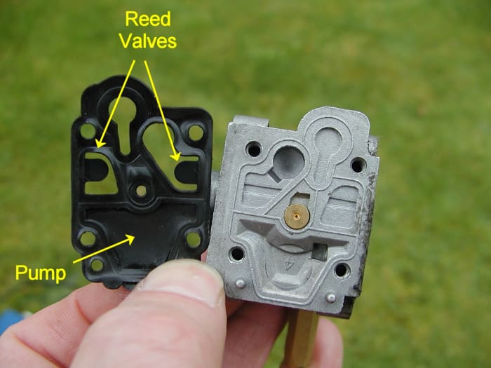 The other half of the carburetor. Part of the jet assembly is in the center.