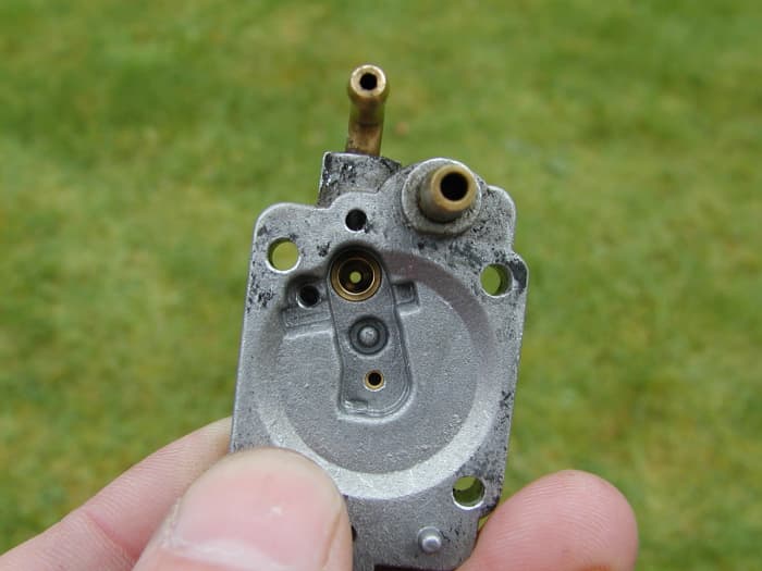 The needle valve seat. Clean this with carburetor cleaner.