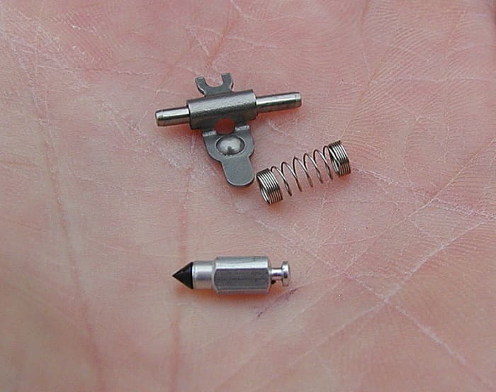 Needle, metering lever, and spring.