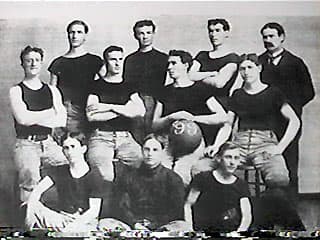 The 1899 University of Kansas men's basketball team. Their coach and inventor of the sport, Dr. James Naismith, is in the top right.