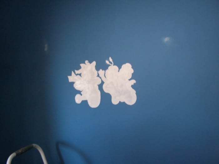 Here are the characters painted with white paint primer. You may need a small brush to get the fine, outer detail as we did.