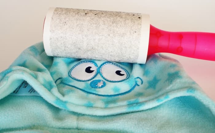 Pilling and lints balls are unsightly and annoying. One way to remove the fuzz is to use a lint roller.