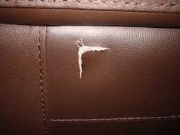 This is an Arrow or V shaped tear, which can be really hard to sew together if the V is more narrow. This one would be quite tricky as well, and professional assistance might be a better way to go.
