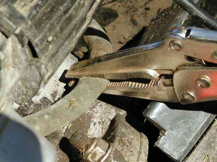 Fuel line clamped off with vise grips.