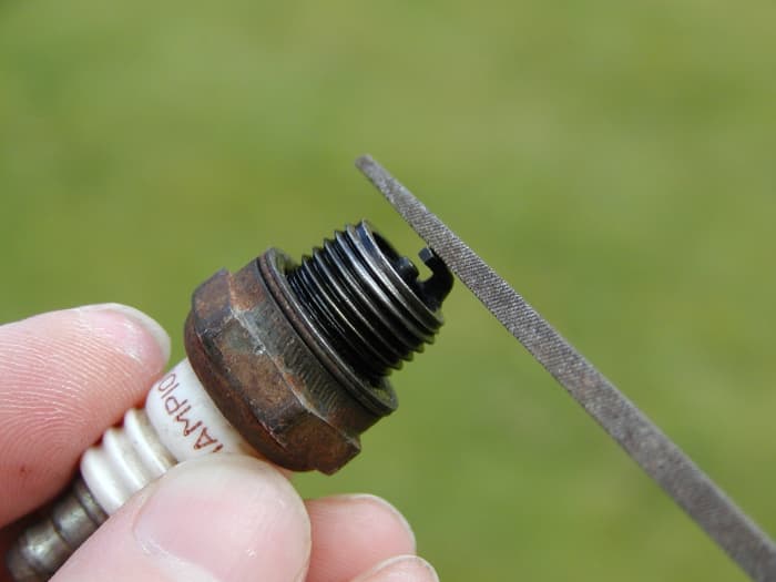 The outer electrode of the plug should be filed square if it is excessively rounded.