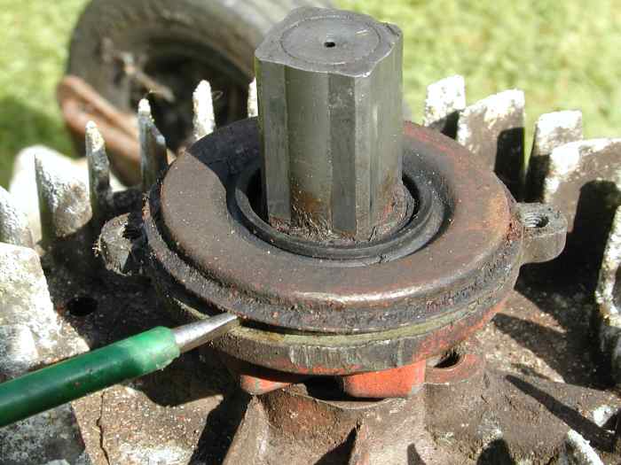 Prise off the plate covering the ratchet mechanism.