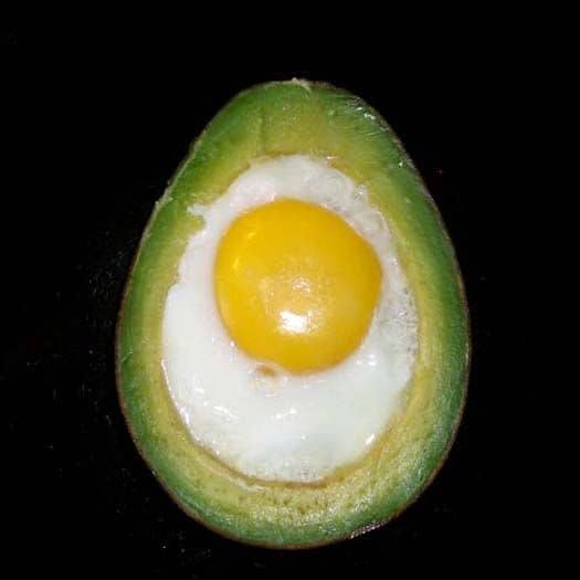 Avocado with cooked egg inside it. Moments later, this clever brunch tidbit was being stabbed with whole-grain toast.