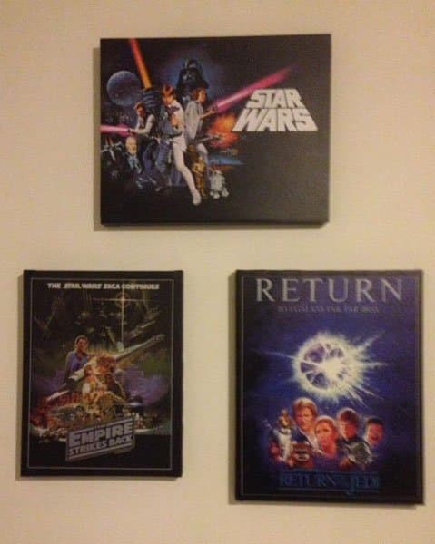 These are canvas posters displayed in my son's man cave. They are all stretched over a mounting frame. Canvas posters are usually bought this way, and are hung without a outside frame.