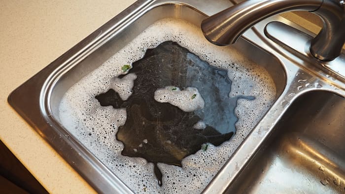 kitchen sink clogged with mud