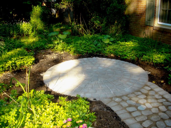 Our completed paver patio and walkway. It's time to add landscape lighting, plant more, and set up outdoor furniture.