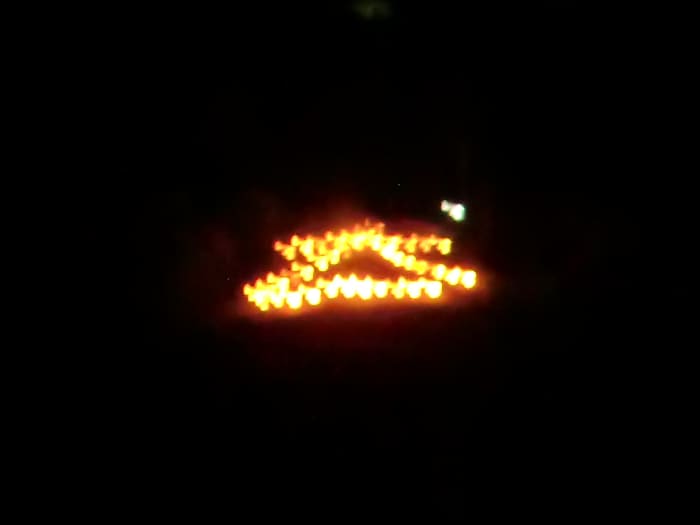The kanji "dai-ichi" or "big one" burning atop of Satsuki Mountain seen from the Inagawa River