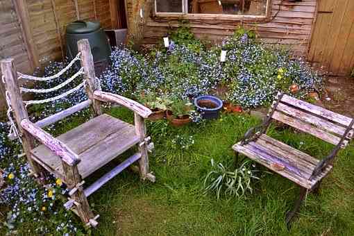 Rustic wood chairs on the grass