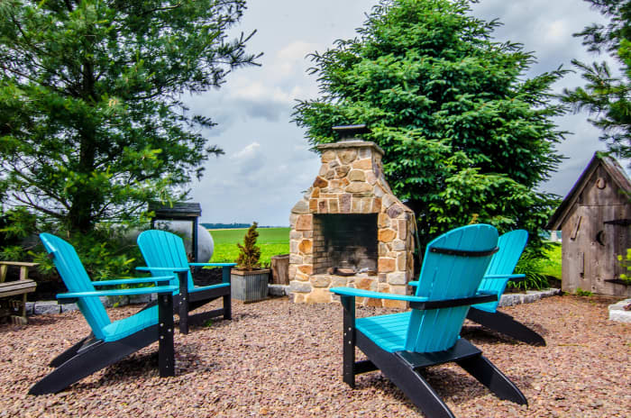 Gravel seating area around a permanent fireplace