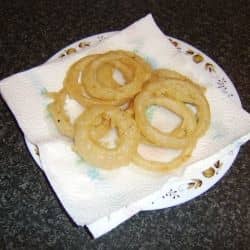 Why pay for high-priced restaurant onion rings when you can make better ones at home? Check out the recipes below!