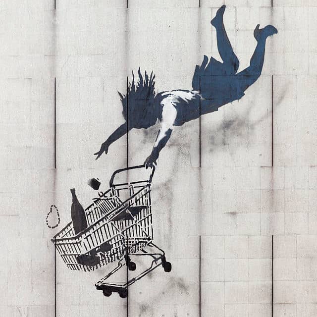 Shop Until You Drop by Banksy. This mural is in Mayfair, London. Beginning in Bristol, England, Banksy's work can now be found across many cities in the UK and around the world.