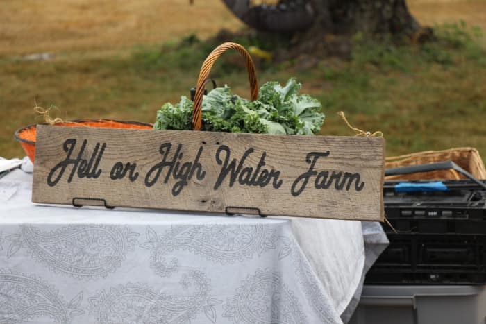 This sign is portable so the farm owners can take it to farmer's markets. Quite a creative name for their home.