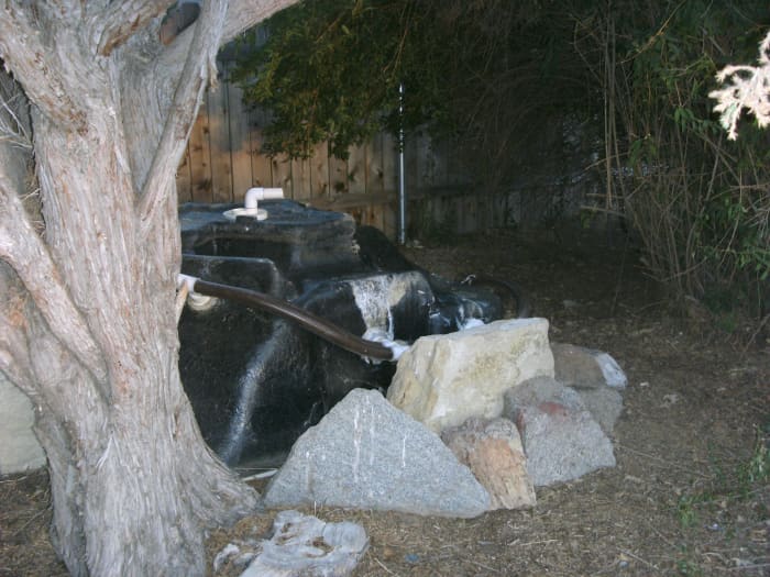 Off the deck, something needed to be done with the old hot tub; it is now a mountain, waiting to be climbed by little ones.
