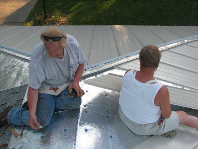 this run of steel panels in to the valley were the only ones that had to be cut at angles on both ends, brother and sister working together