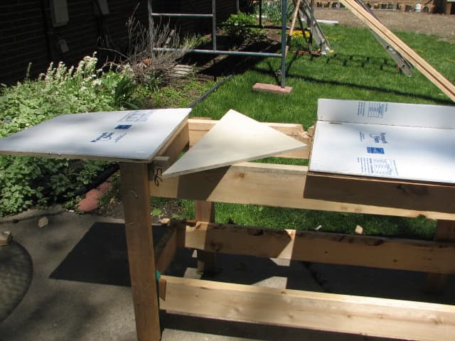 a hole cut at the end and an extension attached for added support allows for cutting all angles and straight edges can be cut from either end of the bench