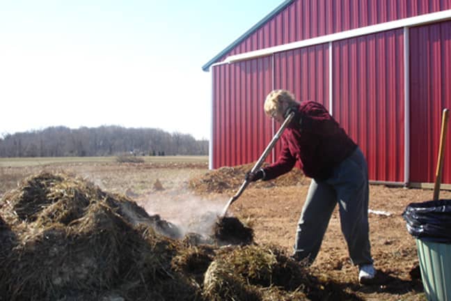 Here I am shoveling chicken poop. Check out the steam. That stuff was pretty warm. This was in February.