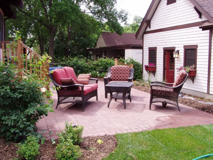 You always want to tilt your patio slightly away from the house to prevent pooling of water near your foundation.