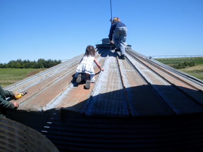 My kids, who have been on grain bin building sites nearly all their lives, can't resist a lowered roof.