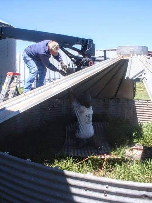 You will need one person inside with vice grips, and another outside with an impact wrench (this picture was taken about halfway through the roof disassembly process).