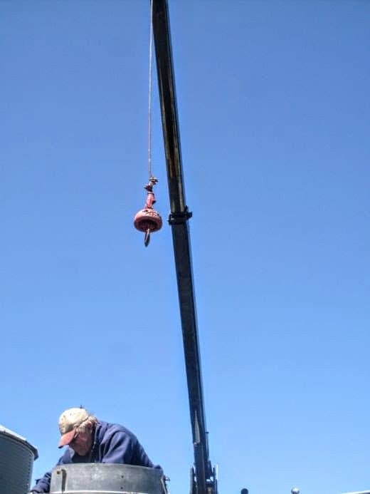 Remove the lifting ring if it is in the way...which it eventually will be. Some bolts are tricky to reach, from either inside or outside the bin.