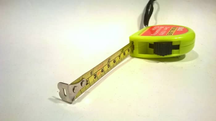 Tape marked with inch and centimetre graduations. A 3 metre (10 foot) tape is nice and compact and fits in a pocket. A 6 or 7 metre tape can be used for longer measurements