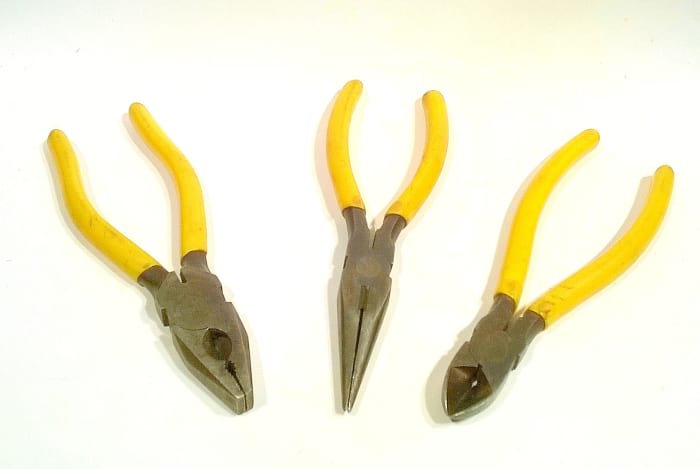 From left to right, standard pliers, long (snipe) nose pliers, wire snips (side cutters)