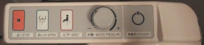 Control panel of a medium-sophisticated Japanese toilet, located in the Asahikawa Grand hotel in Asahikawa, Japan.
