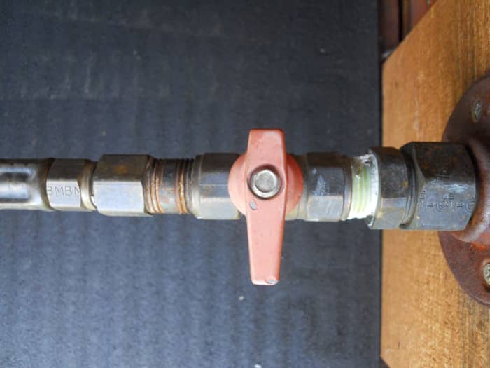 It may be as simple as turning on the gas to the water heater. This handle is in the "off" position.