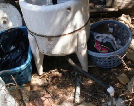 Position baskets however it is most convenient to both fill the machine with new loads, and catch finished ones once they've been wrung. Don't overfill baskets, unless you are a weight-lifting champion.