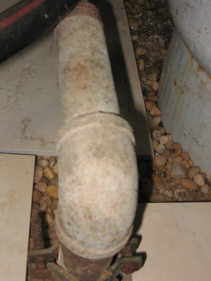 Photo by the author, showing where the old fifty year old point had been. The existing well point is approximately one to two feet away from the new point. It is not necessary to remove the old point-this is just extra work.
