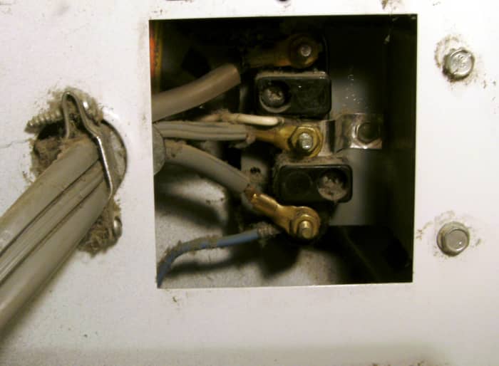 Three prong cord still connected. Note the metal piece that goes from the white wire to the frame of the dryer.