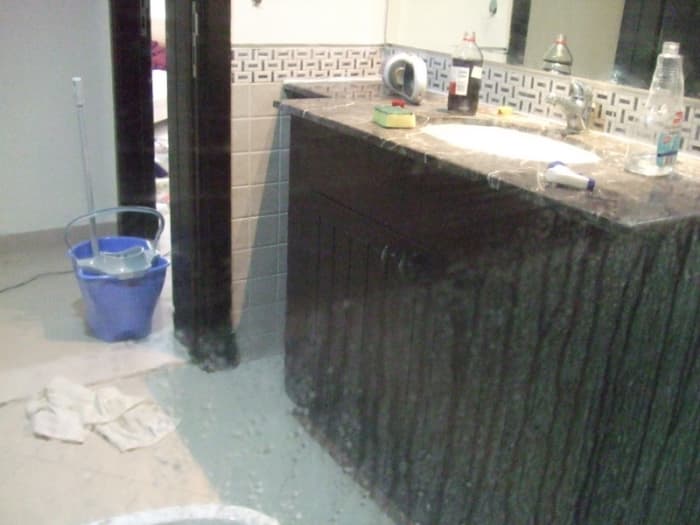 In this photo taken through the shower door, hopefully you can see the difference between the top of the door that has been cleaned with vinegar and the bottom that hasn't.