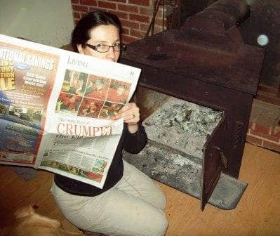 I probably should save this piece of newspaper for gift wrap. But, I decided to "reuse" it anyway - in the wood stove. Notice the little orb in the camera view.