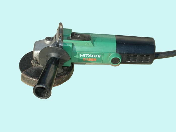 Typical 4 1/2 inch, 600 watt grinder manufactured by Hitachi, now known as Hikoki.