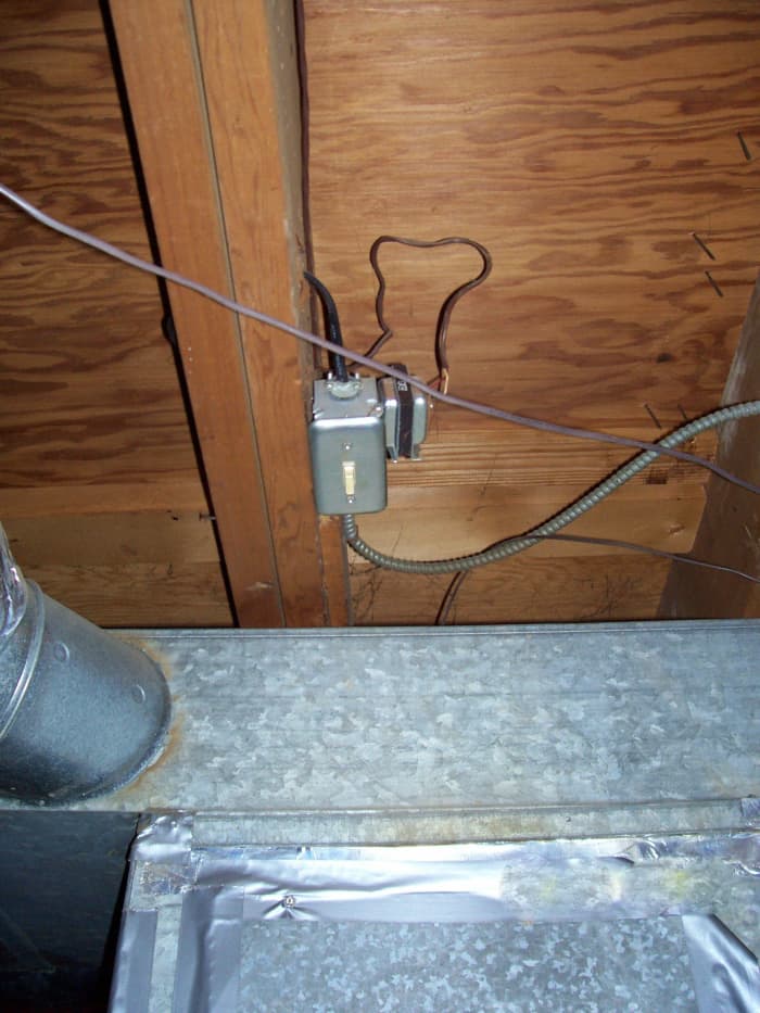 A toggle switch that has been mounted in the ceiling near the furnace. Your toggle switch may be on the furnace, or you may have to shut off the unit at the circuit-breaker panel.