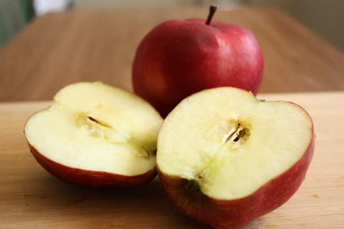 Cut apples in half to absorb unwanted odors.