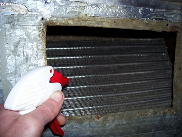 Through this opening, I am able to spray down the coil with a good dose of cleaner and let the unit do the rest.